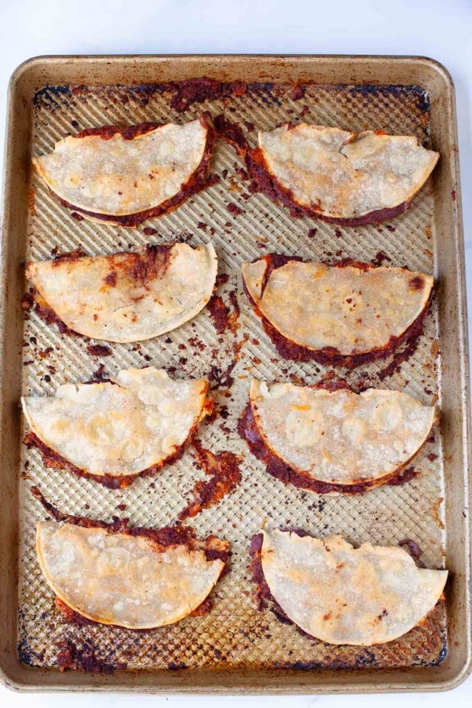 cooked crispy black bean tacos on baking sheet